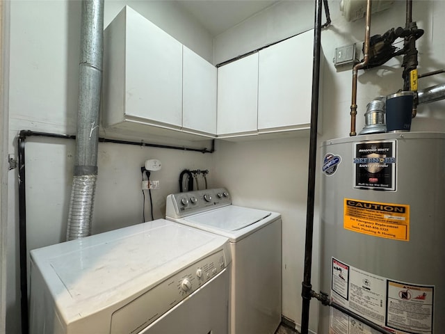 laundry area featuring cabinet space, gas water heater, and independent washer and dryer