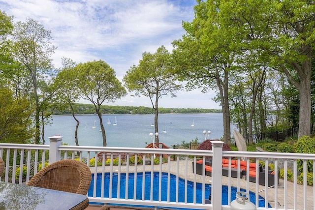 wooden deck with a water view