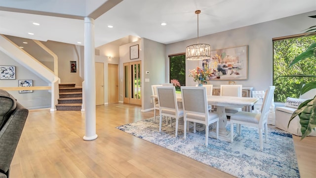 12 Sunset Path, Port Jefferson, NY 11777 - dining space with stairs, wood finished floors, decorative columns, a chandelier, and recessed lighting