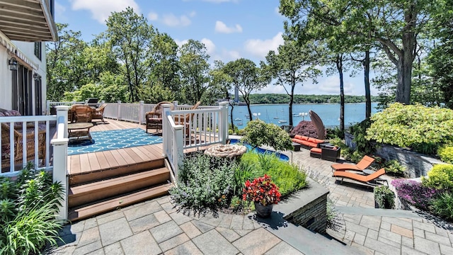 12 Sunset Path, Port Jefferson, NY 11777 - wooden terrace featuring a water view, a patio, outdoor dining space, and an outdoor living space