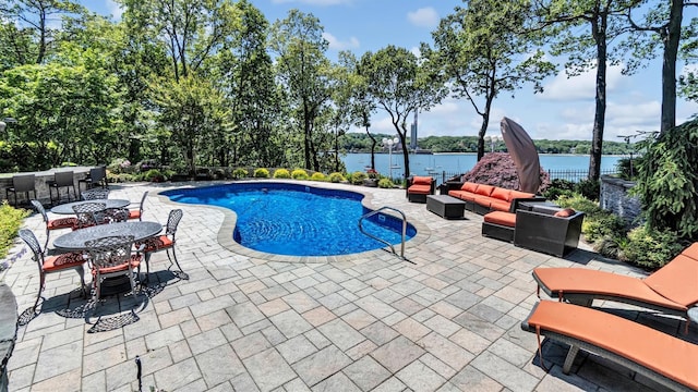 12 Sunset Path, Port Jefferson, NY 11777 - view of swimming pool featuring a patio area, outdoor lounge area, and a water view