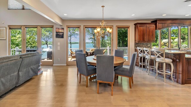 12 Sunset Path, Port Jefferson, NY 11777 - dining area with a chandelier, light wood-style flooring, baseboards, and recessed lighting