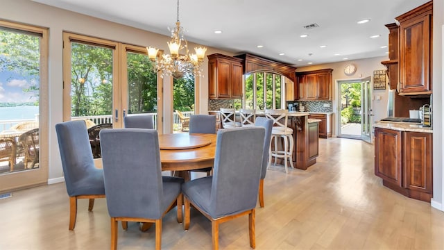 12 Sunset Path, Port Jefferson, NY 11777 - dining area with a chandelier, light wood-type flooring, and recessed lighting