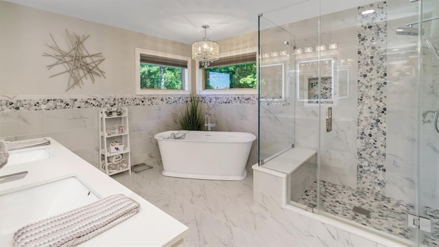 12 Sunset Path, Port Jefferson, NY 11777 - bathroom featuring a soaking tub, a stall shower, tile walls, and a chandelier