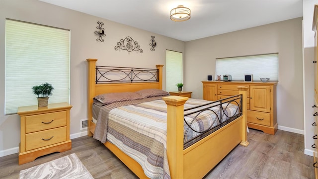 12 Sunset Path, Port Jefferson, NY 11777 - bedroom featuring light wood-style flooring and baseboards