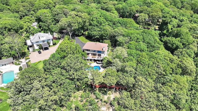 12 Sunset Path, Port Jefferson, NY 11777 - view of property location with a pool and a heavily wooded area