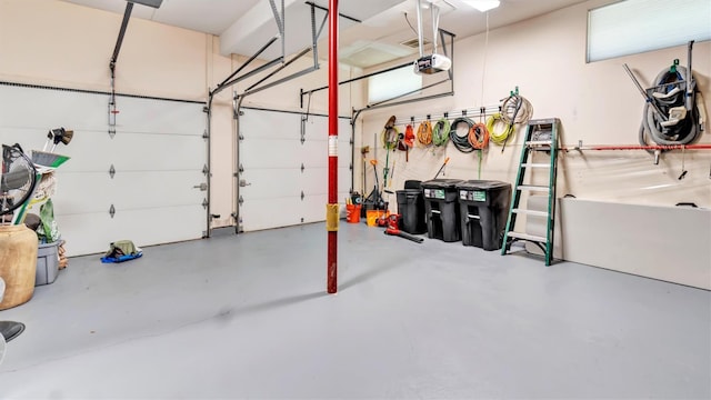 12 Sunset Path, Port Jefferson, NY 11777 - garage featuring a garage door opener