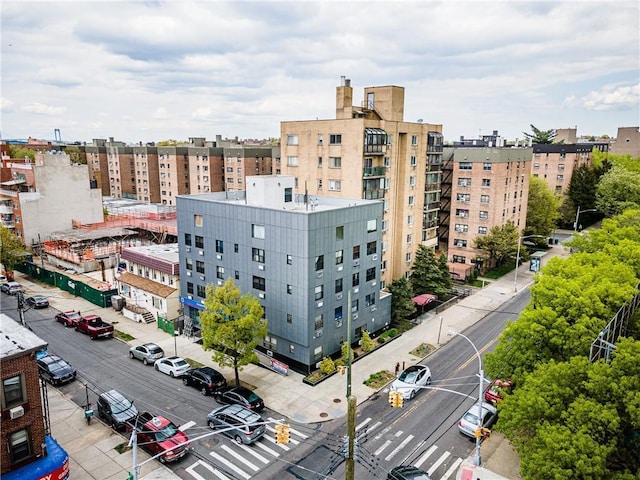 view of building exterior featuring uncovered parking
