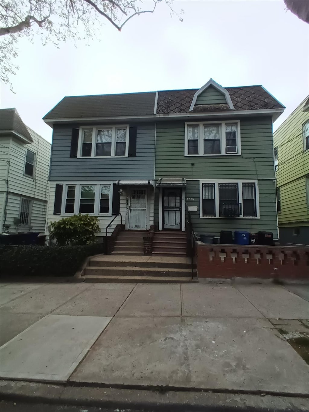 42-50 65th St, Woodside, NY 11377 - townhome / multi-family property with entry steps
