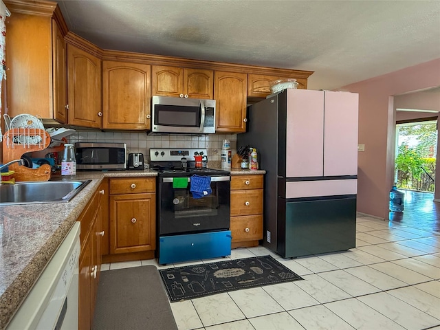 1 Palmer Pl, Valley Stream, NY 11580 - kitchen with stainless steel microwave, range with electric stovetop, a sink, and freestanding refrigerator