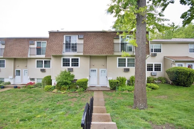 11 The Blvd Unit A4, Cold Spring, NY 10516 - view of front of house featuring a front yard, mansard roof, and a wall mounted AC