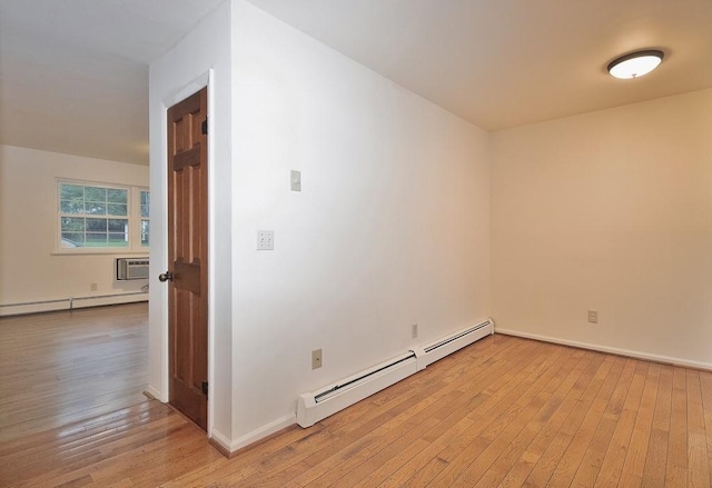 11 The Blvd Unit A4, Cold Spring, NY 10516 - spare room featuring a baseboard heating unit, light wood-style flooring, and baseboards