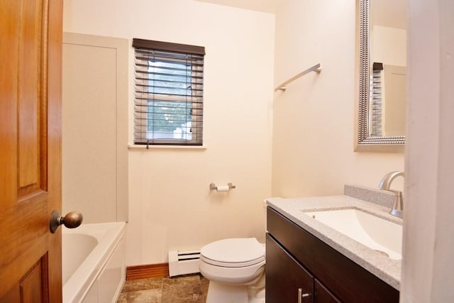 11 The Blvd Unit A4, Cold Spring, NY 10516 - full bathroom featuring baseboard heating, toilet, a bathtub, vanity, and baseboards