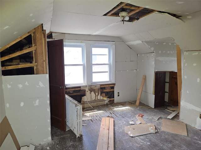 additional living space featuring lofted ceiling
