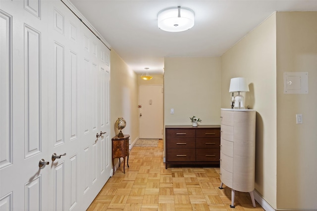 hallway featuring baseboards