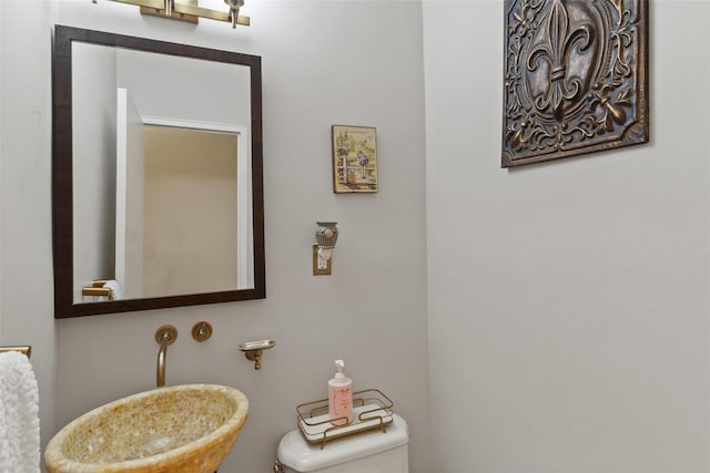 bathroom featuring toilet and a sink