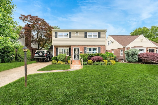 11 Durham Rd, New Hyde Park, NY 11040 - colonial home with a front lawn, brick siding, and driveway