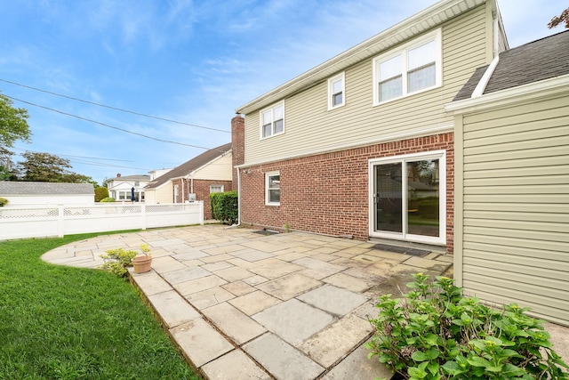 11 Durham Rd, New Hyde Park, NY 11040 - back of property featuring brick siding and a patio area