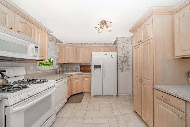 11 Durham Rd, New Hyde Park, NY 11040 - kitchen featuring white appliances, light brown cabinets, wallpapered walls, a wainscoted wall, and light countertops