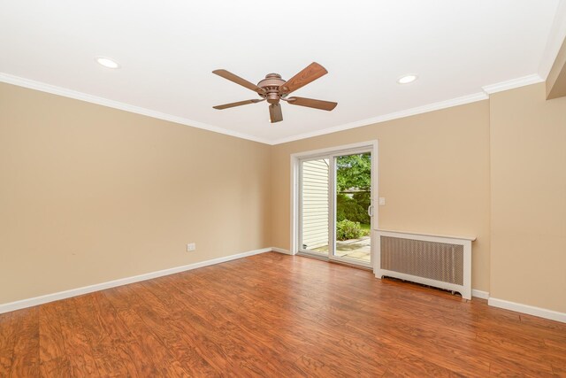 11 Durham Rd, New Hyde Park, NY 11040 - unfurnished room with radiator, wood finished floors, crown molding, baseboards, and ceiling fan
