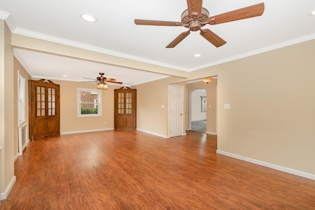 11 Durham Rd, New Hyde Park, NY 11040 - spare room with arched walkways, a ceiling fan, wood finished floors, baseboards, and ornamental molding