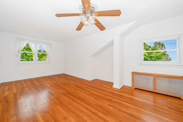 11 Durham Rd, New Hyde Park, NY 11040 - empty room with light wood finished floors and a ceiling fan