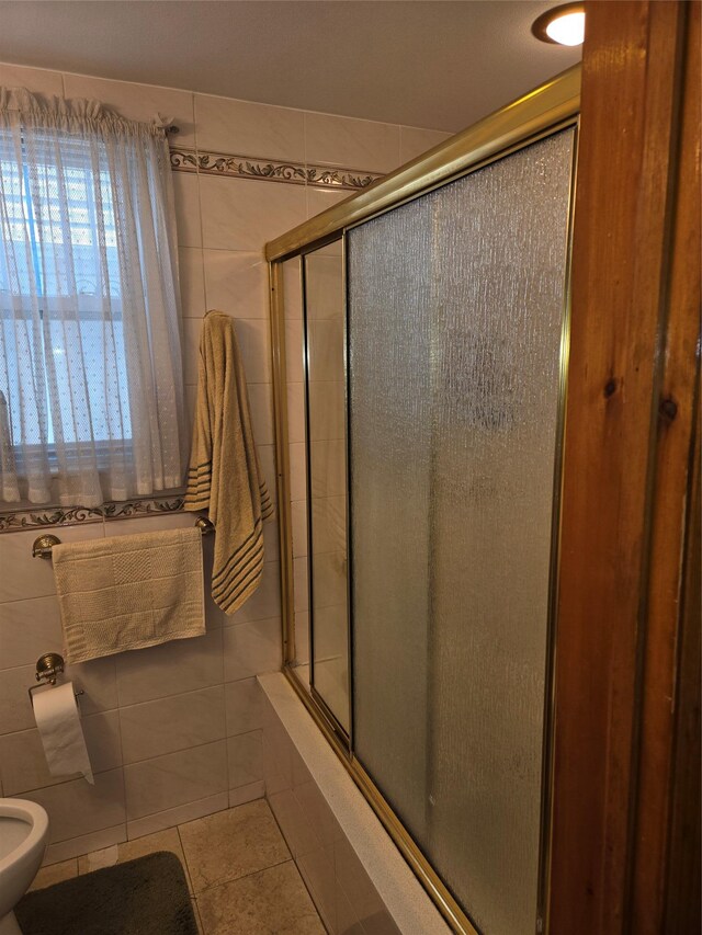 3915 Clarendon Rd, Brooklyn, NY 11203 - bathroom with tile walls, tile patterned floors, a tile shower, and a bidet