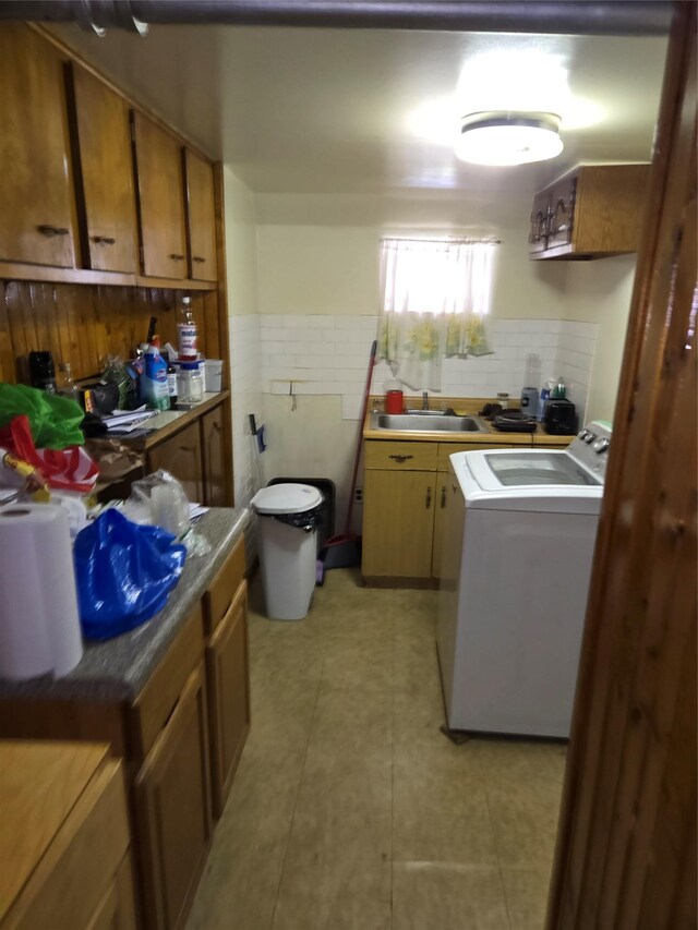 3915 Clarendon Rd, Brooklyn, NY 11203 - laundry area featuring washer / dryer, wainscoting, and tile walls