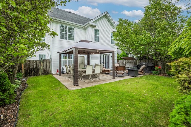 40 Ethan Cir, Middle Island, NY 11953 - rear view of property with a patio, a shingled roof, and a gazebo
