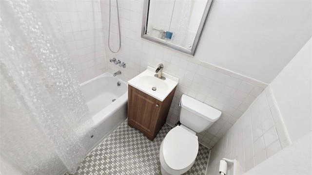 160-10 89th Ave Unit 9A, Jamaica, NY 11432 - bathroom with tile walls, toilet, shower / bathtub combination with curtain, vanity, and a wainscoted wall