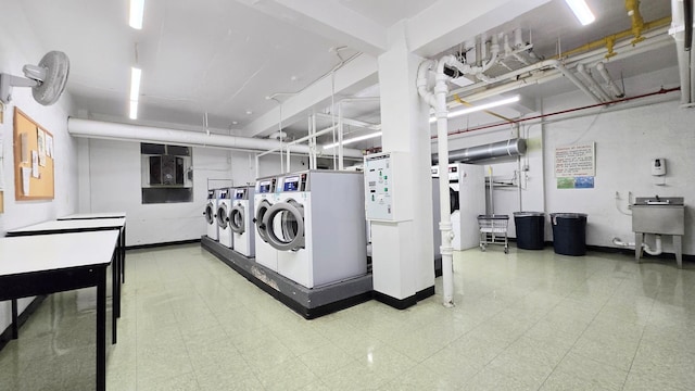 160-10 89th Ave Unit 9A, Jamaica, NY 11432 - shared laundry room with washer and dryer and tile patterned floors