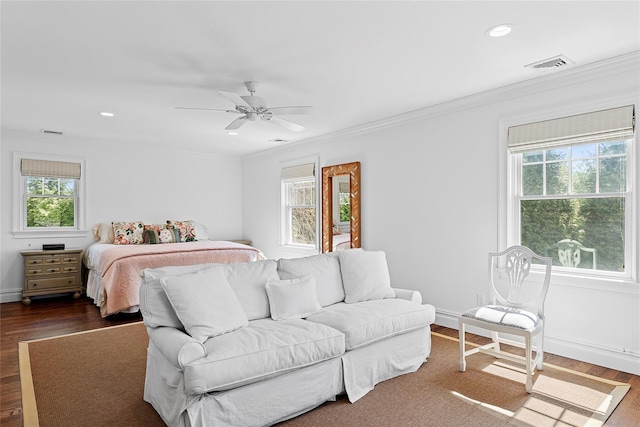 bedroom with multiple windows, crown molding, dark wood-type flooring, and recessed lighting