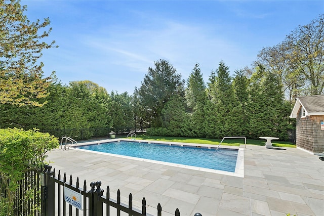 view of pool featuring a patio area and fence