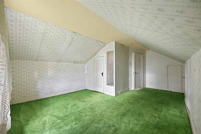 bonus room featuring lofted ceiling, carpet floors, and baseboards