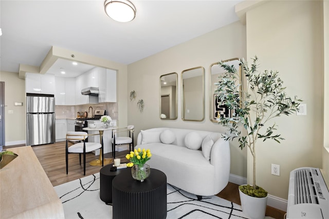 163-07 72nd Ave Unit 5C, Fresh Meadows, NY 11365 - living room with light wood-style floors and baseboards