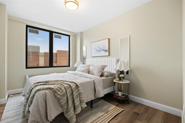 163-07 72nd Ave Unit 5C, Fresh Meadows, NY 11365 - bedroom with baseboards, wood finished floors, and radiator