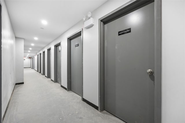 163-07 72nd Ave Unit 5C, Fresh Meadows, NY 11365 - hall featuring concrete floors, recessed lighting, and baseboards