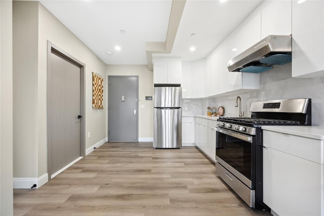 163-07 72nd Ave Unit 4A, Fresh Meadows, NY 11365 - kitchen featuring appliances with stainless steel finishes, under cabinet range hood, modern cabinets, white cabinets, and recessed lighting