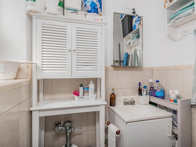 bathroom with tile walls, backsplash, and vanity