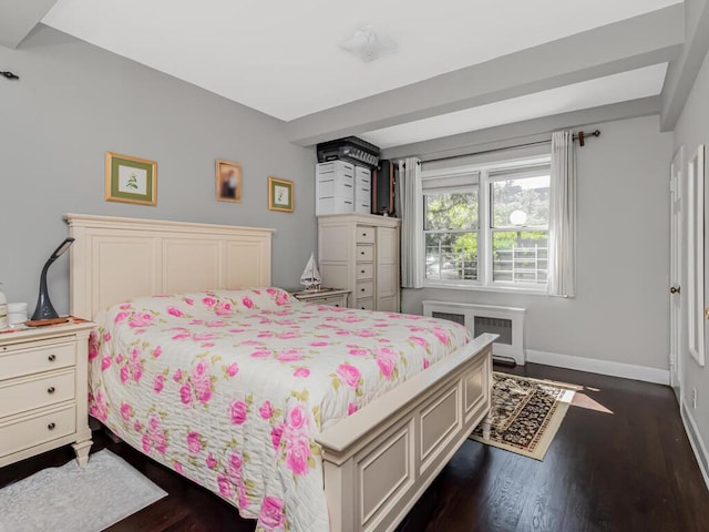 bedroom with baseboards and dark wood-style floors