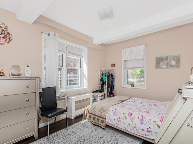 bedroom featuring wood finished floors