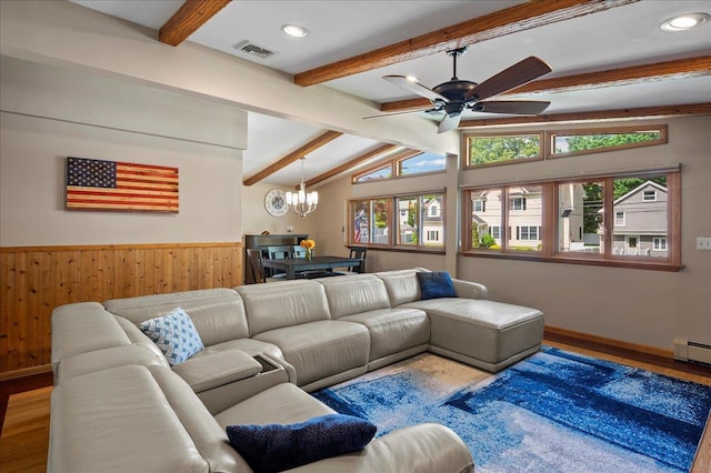 190 1st St, Buchanan, NY 10511 - living room featuring wood finished floors, a chandelier, ceiling fan, a wainscoted wall, and wooden walls