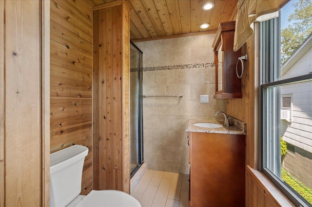190 1st St, Buchanan, NY 10511 - full bathroom with vanity, a stall shower, tile walls, toilet, and recessed lighting