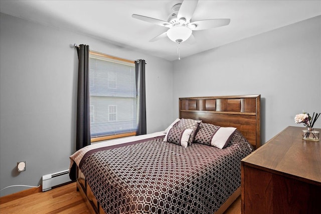 190 1st St, Buchanan, NY 10511 - bedroom featuring a baseboard radiator, a ceiling fan, and wood finished floors