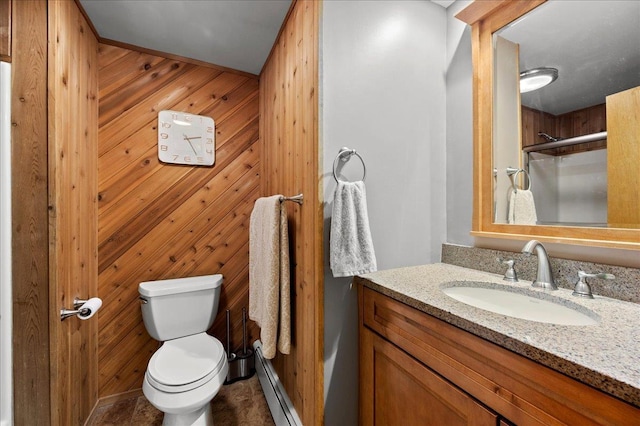 190 1st St, Buchanan, NY 10511 - bathroom with toilet, vanity, a baseboard radiator, a shower, and wood walls