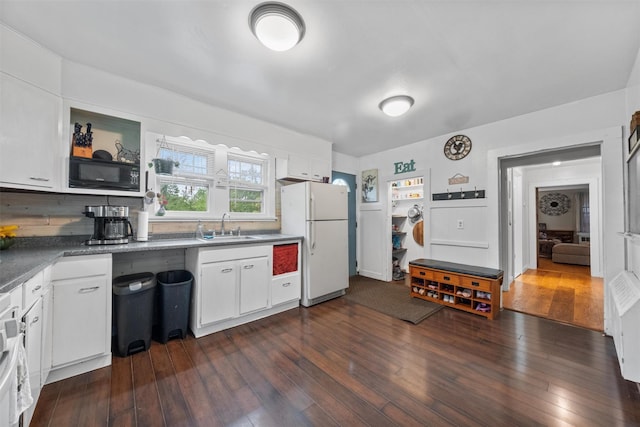 17 Sylvan Lake Rd, Lagrangeville, NY 12540 - kitchen with freestanding refrigerator, a sink, black microwave, and white cabinets
