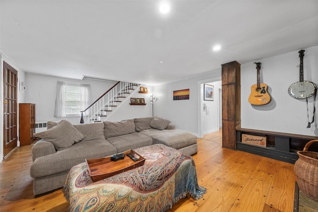 17 Sylvan Lake Rd, Lagrangeville, NY 12540 - living room featuring light wood finished floors, stairway, and radiator