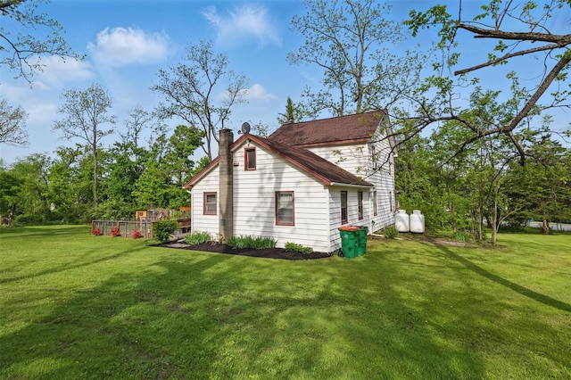 17 Sylvan Lake Rd, Lagrangeville, NY 12540 - view of side of property with a chimney and a yard