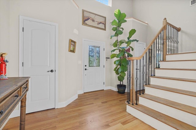8 Tanyas Ct, Monroe, NY 10950 - foyer with light wood-style floors, stairway, baseboards, and a high ceiling