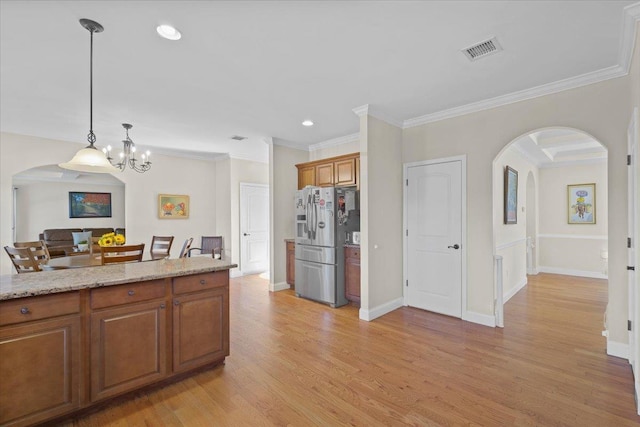 8 Tanyas Ct, Monroe, NY 10950 - kitchen with stainless steel refrigerator with ice dispenser, arched walkways, brown cabinets, a chandelier, and light wood-style floors